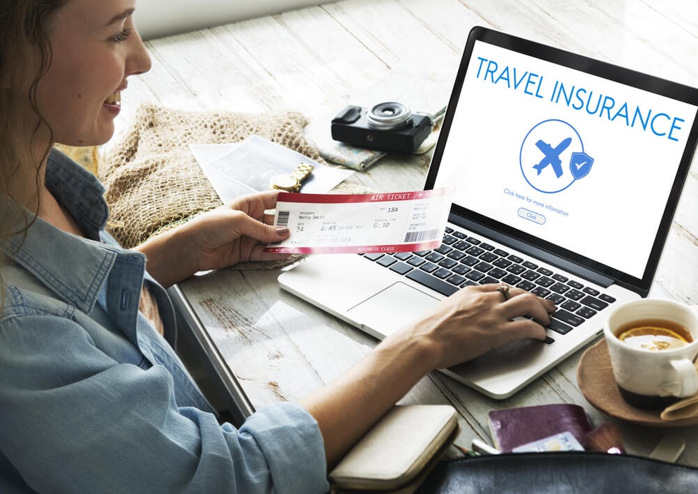 Woman looking up travel insurance