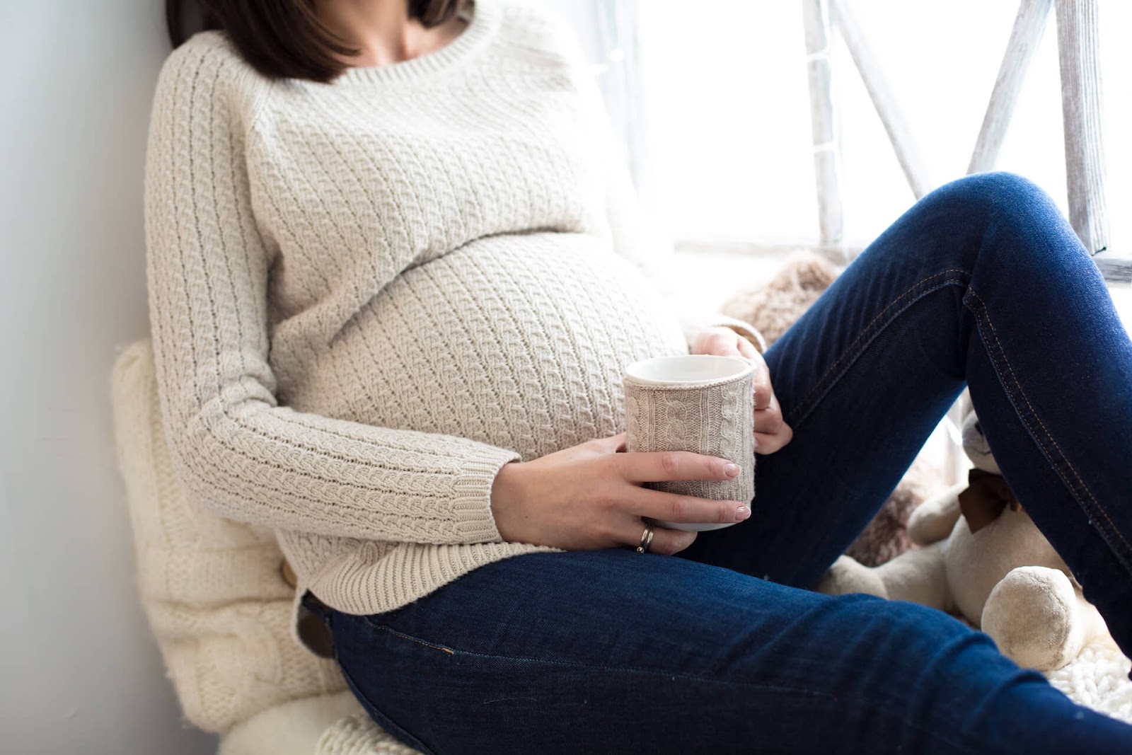 Pregnant woman holding a cup of tea