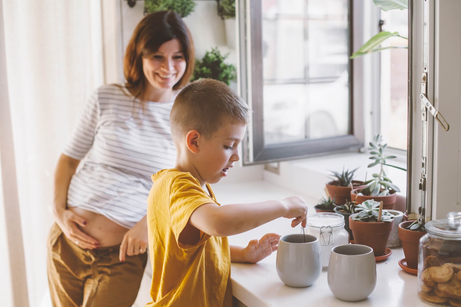 Woman and son making tea