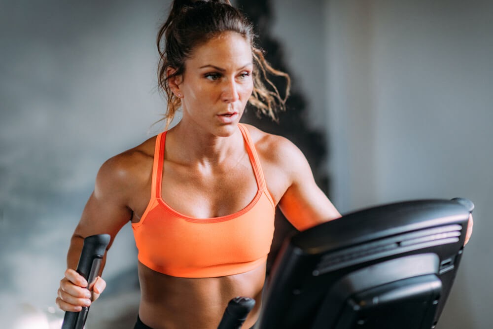 Woman working out on an elliptical