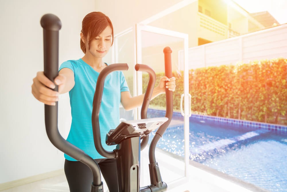 Woman exercising on an elliptical