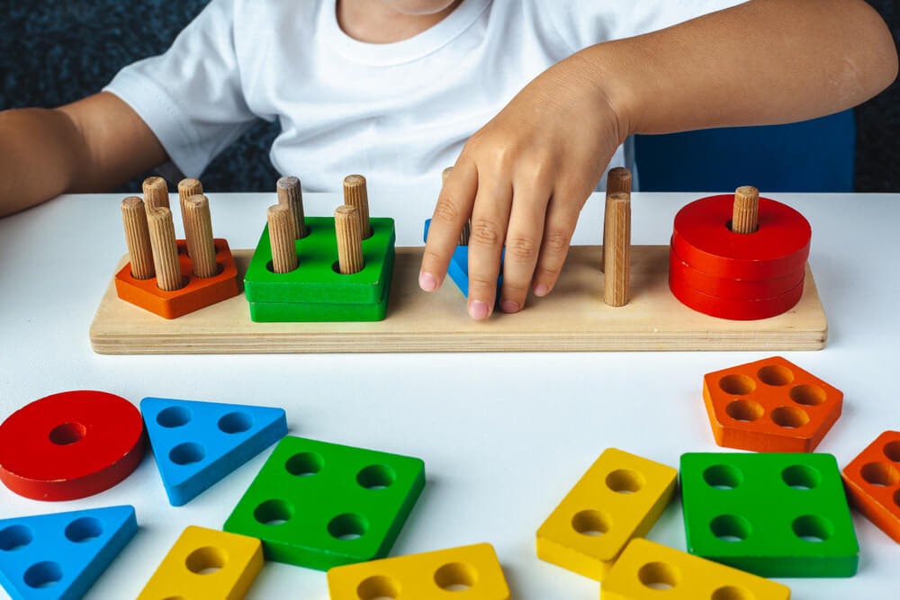 Toddler playing with toys