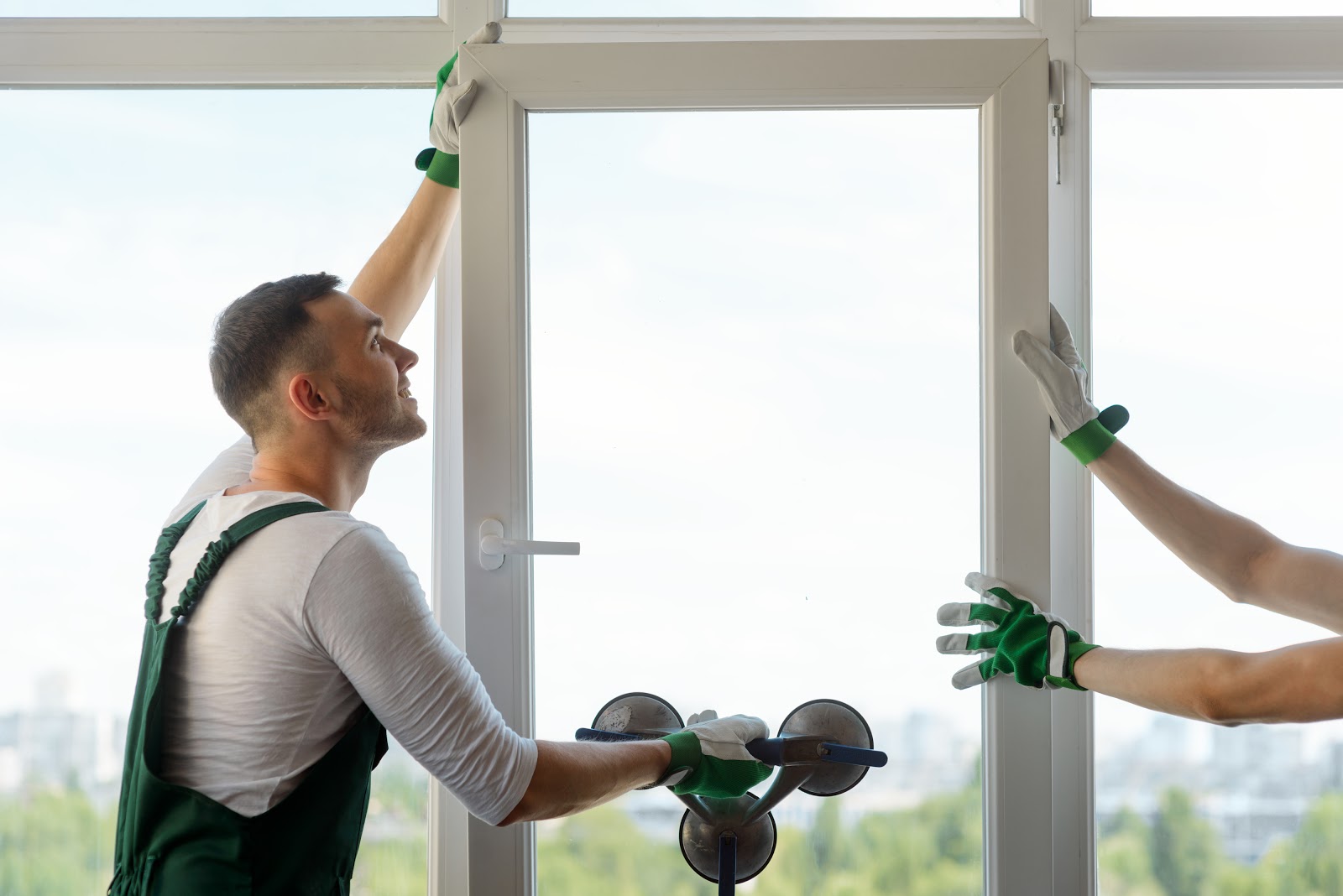 Two men fitting a window