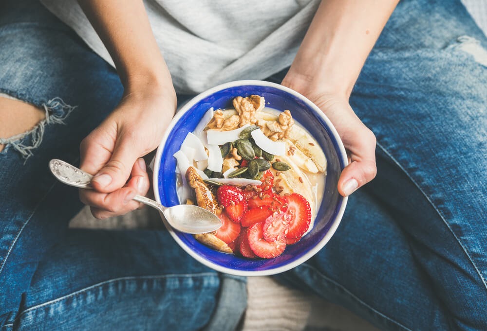 Man holding a plate of yummy food