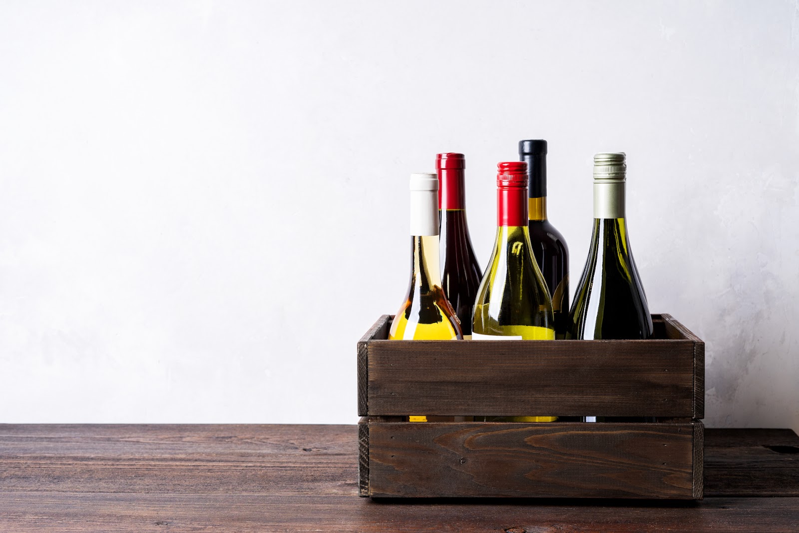 5 Bottles of wine in a crate