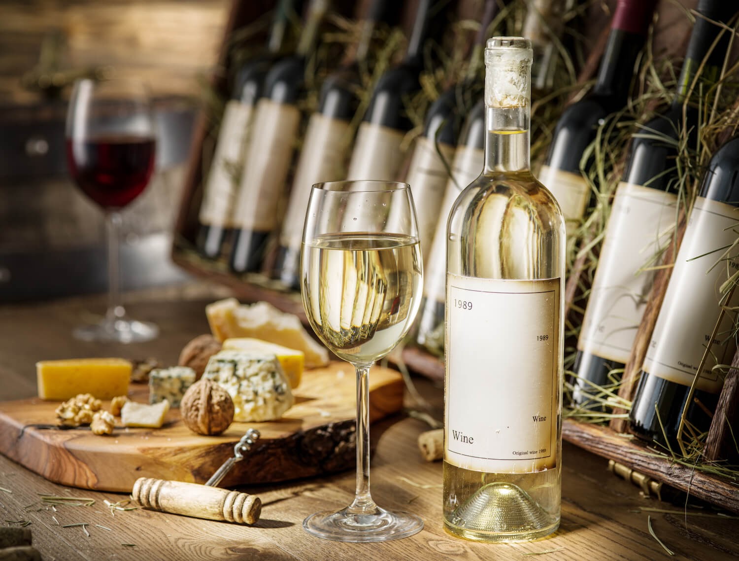 Bottles of wine with a few glasses of wine in front