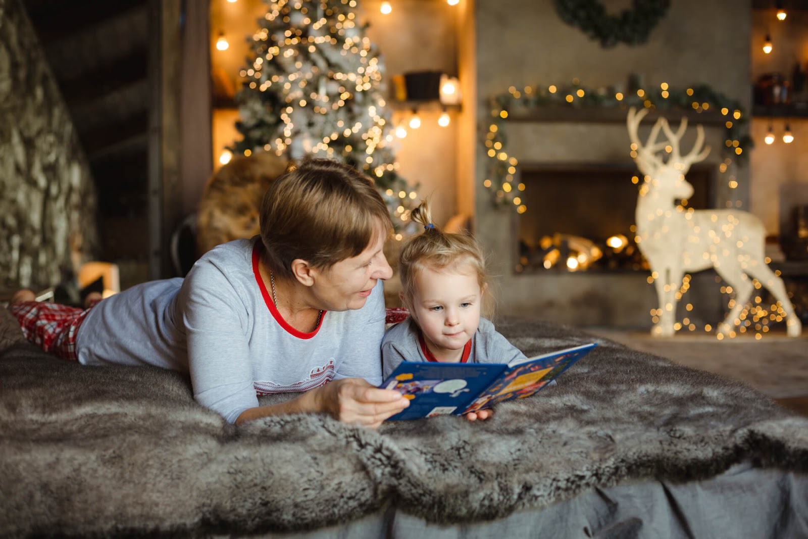 Grandma reading to granddaughter