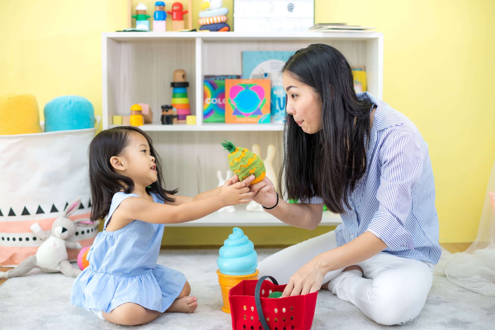 Woman and Child Playing with Plush Toy