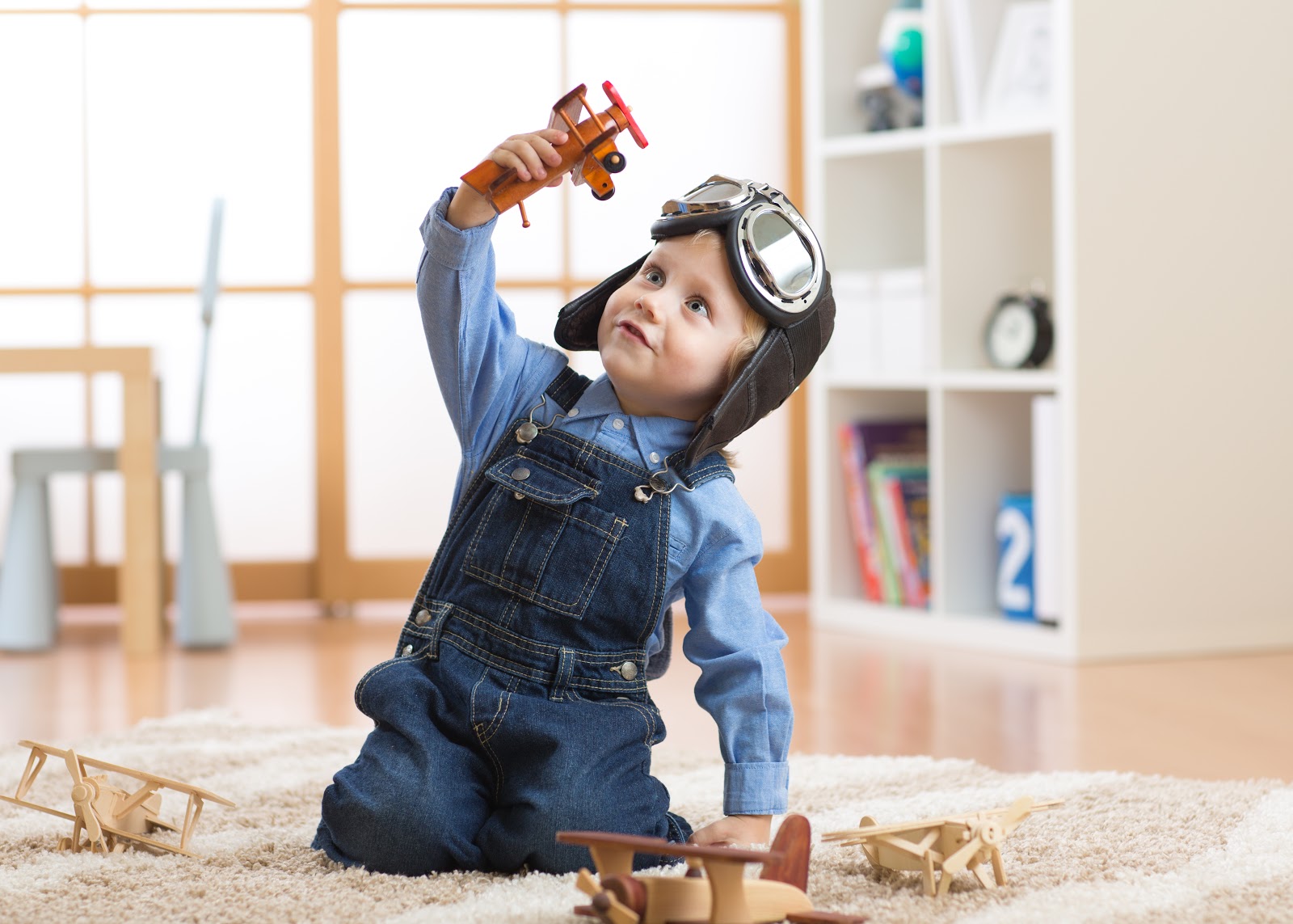 Child Playing with Toy Plane