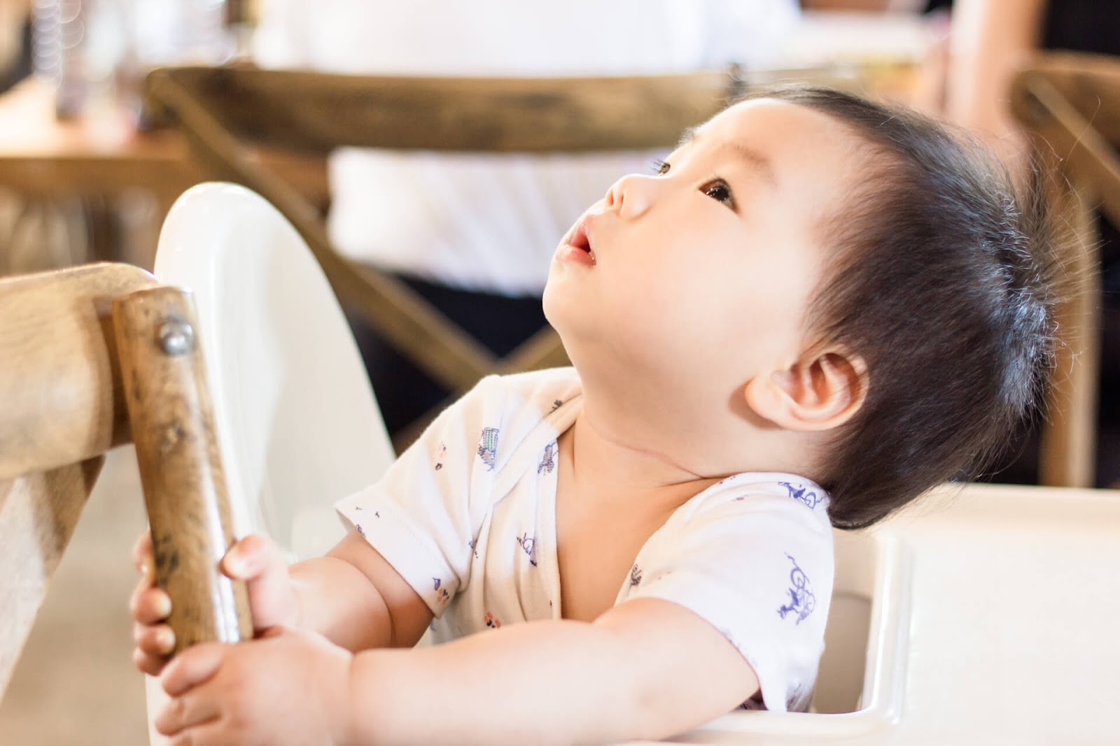 Baby in chair looking up