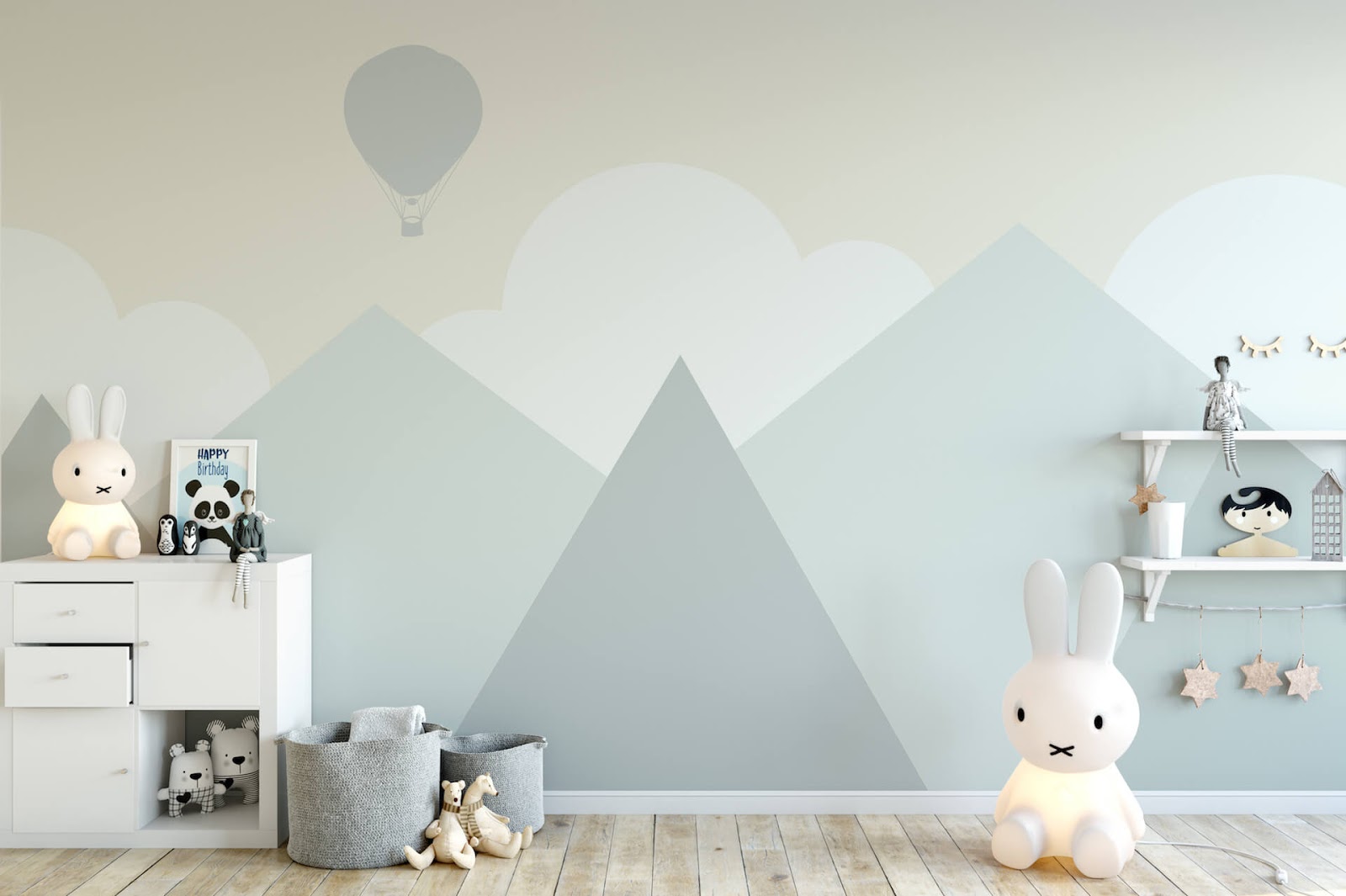 Nursery painted gray with mountains and clouds