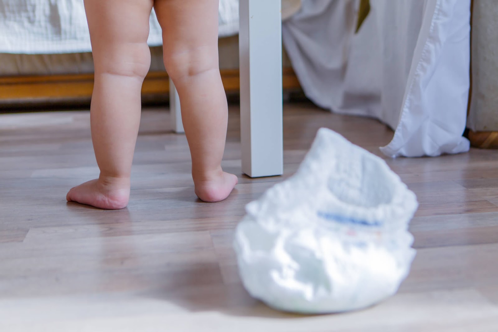 Baby walking away from diaper