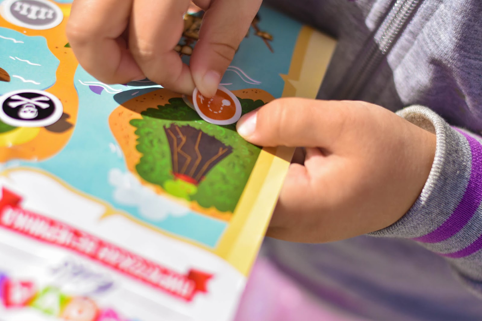Girl putting stickers on a chart