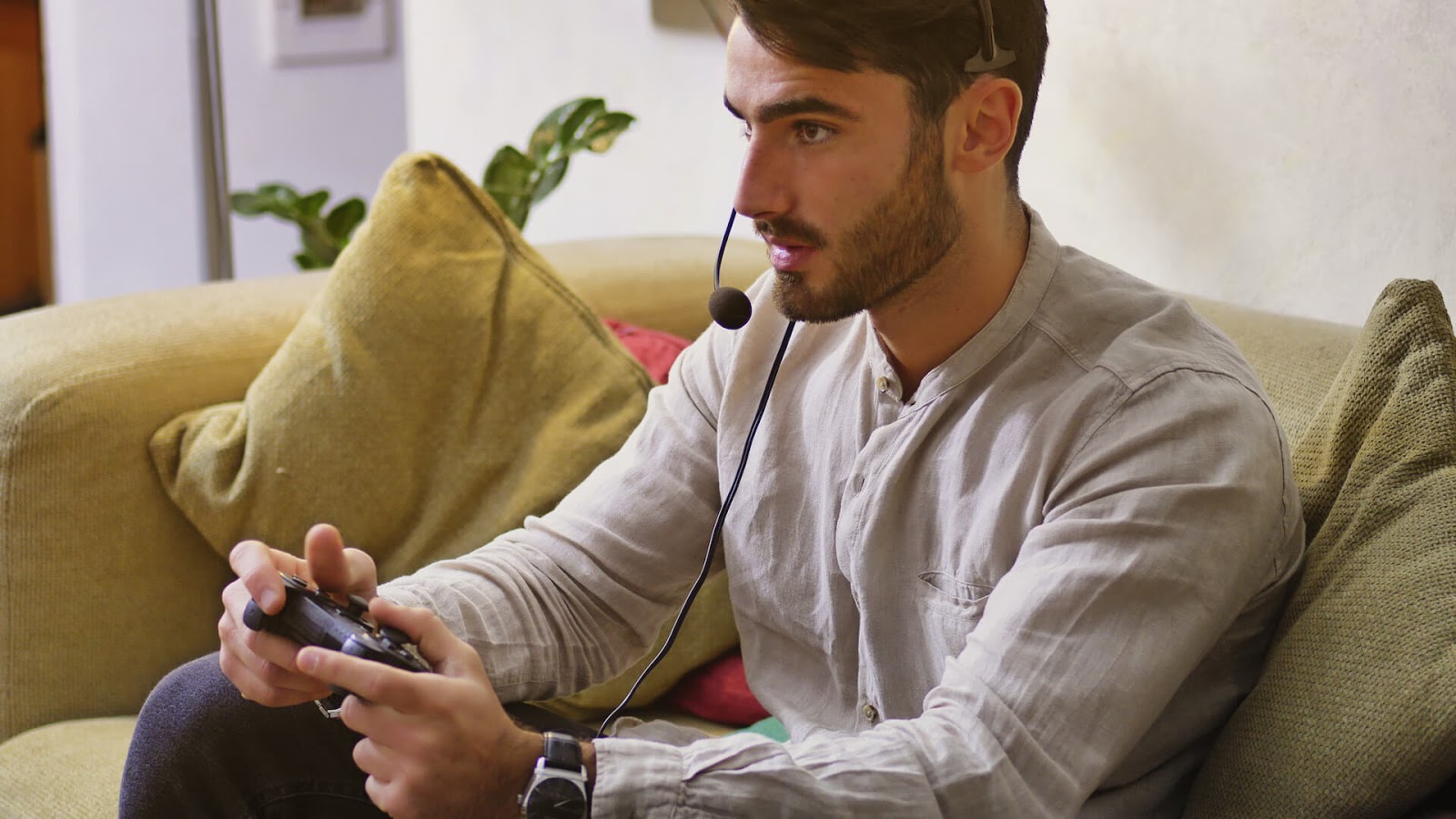Man playing video game with headset on