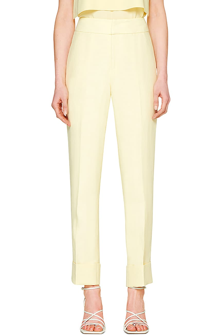 Woman in pastel yellow jumpsuit