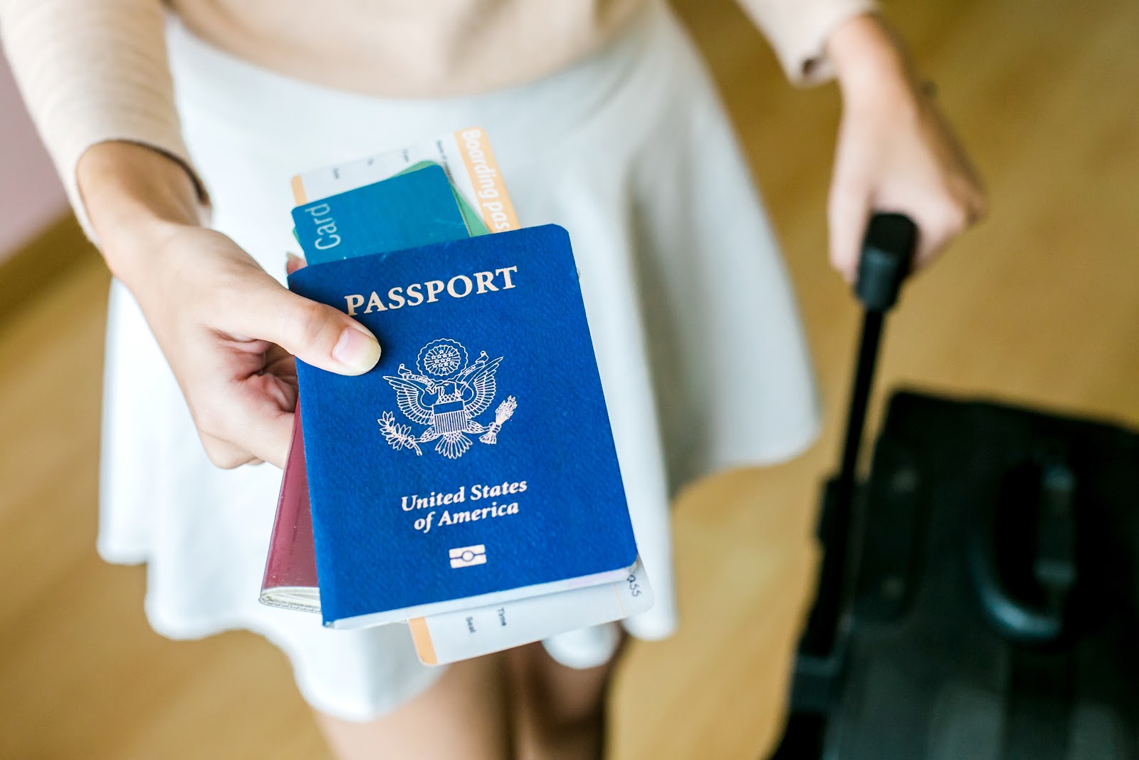 Woman holding out passport