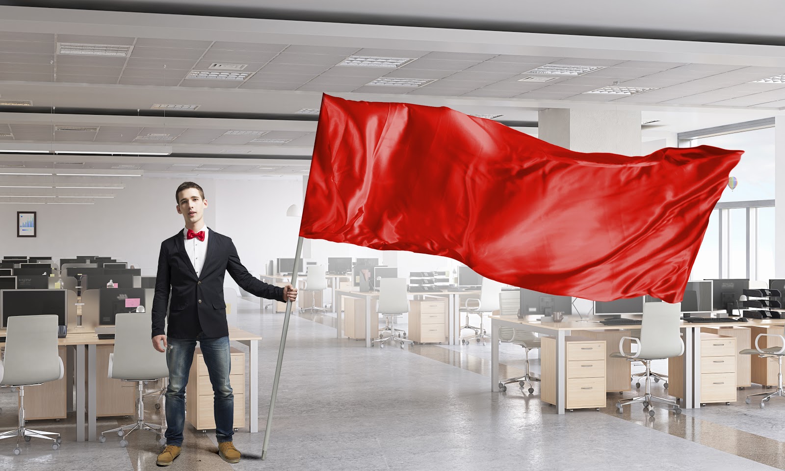 Man waving red flag in office