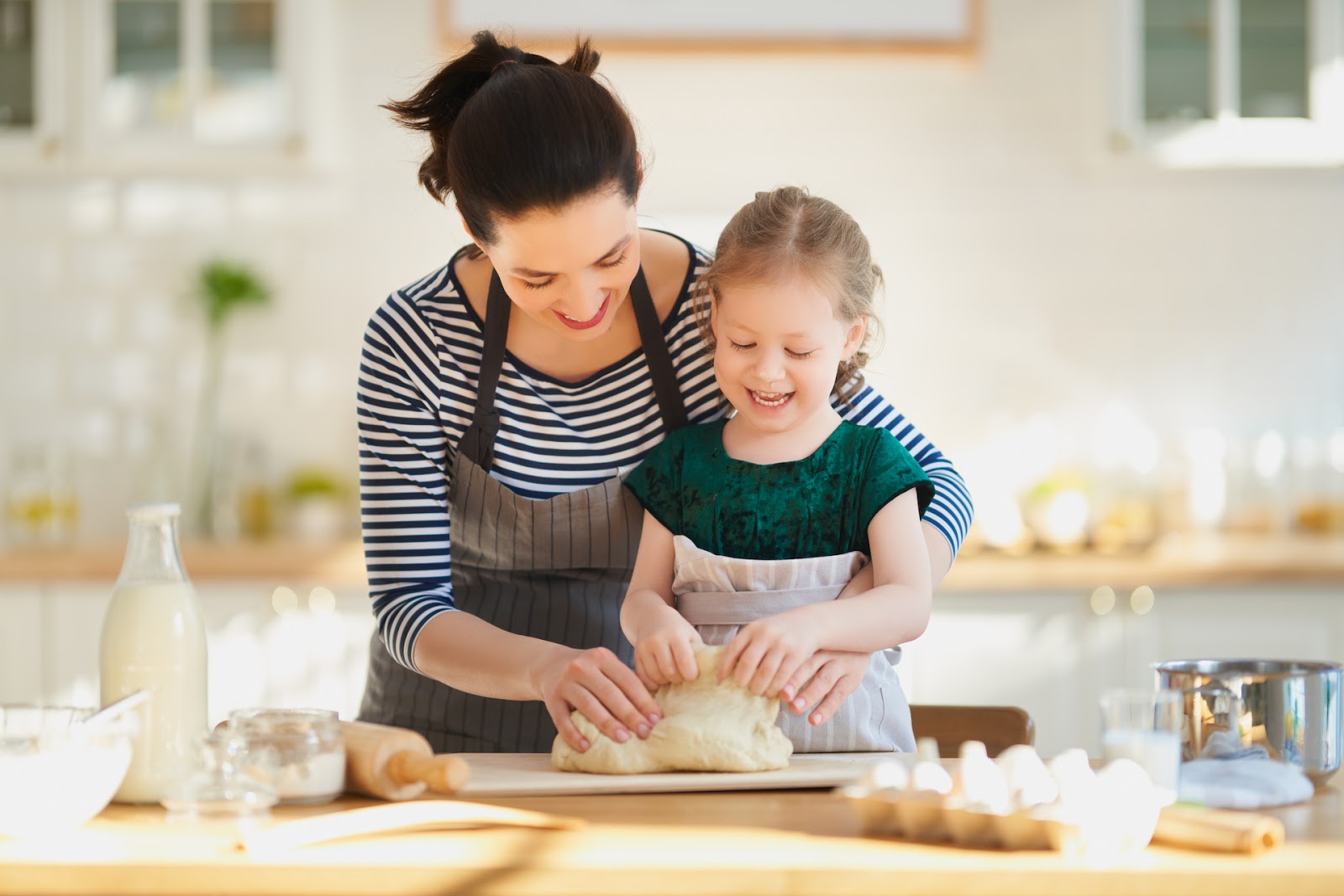 Mom and daughter baking together