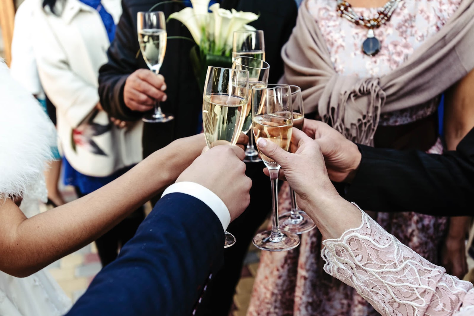 Bridal party "cheers" to the new couple