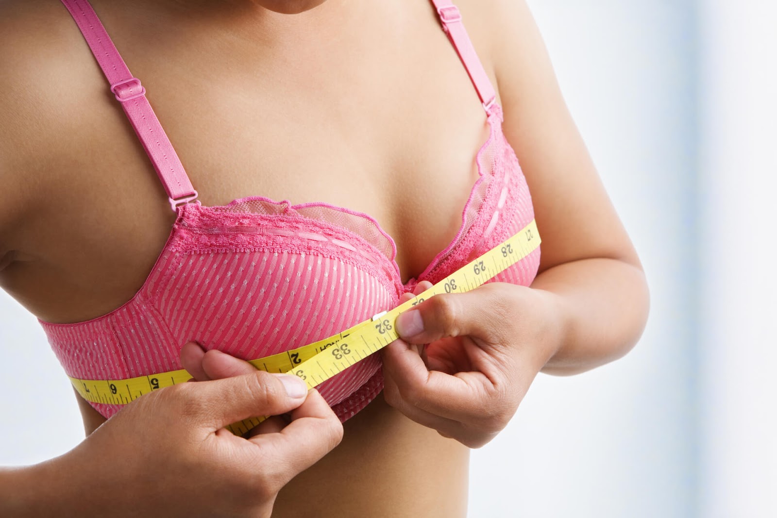 Woman measuring her bust line