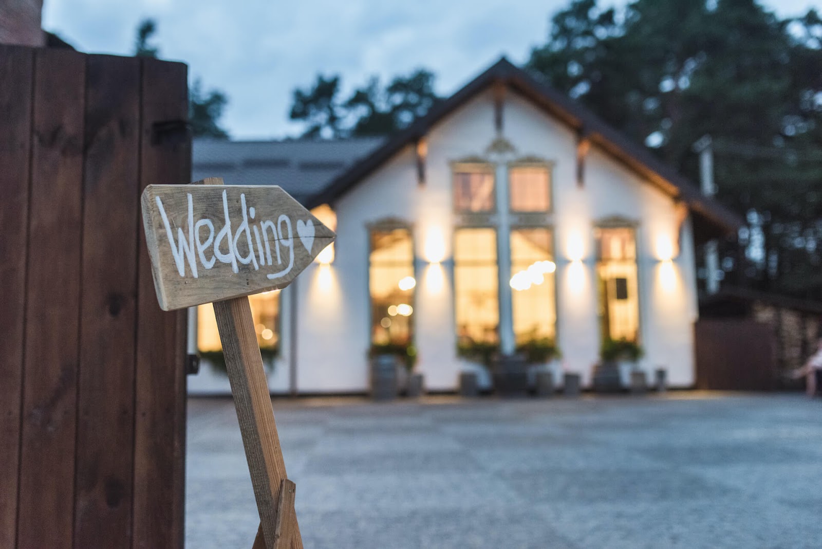 Wedding sign pointing to a building
