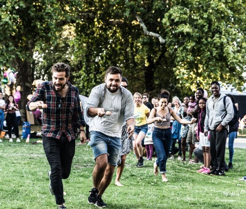Adults racing with eggs on their spoon