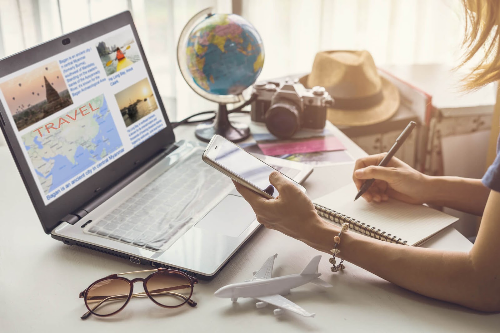 Woman planning a vacation with her frequent flyer perks