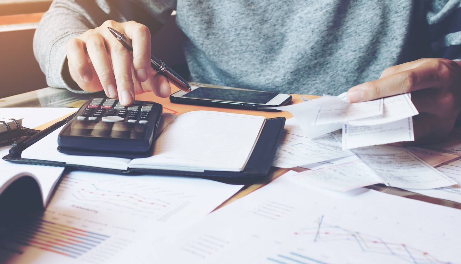 Man calculating the best way to maximie his frequent flyer miles