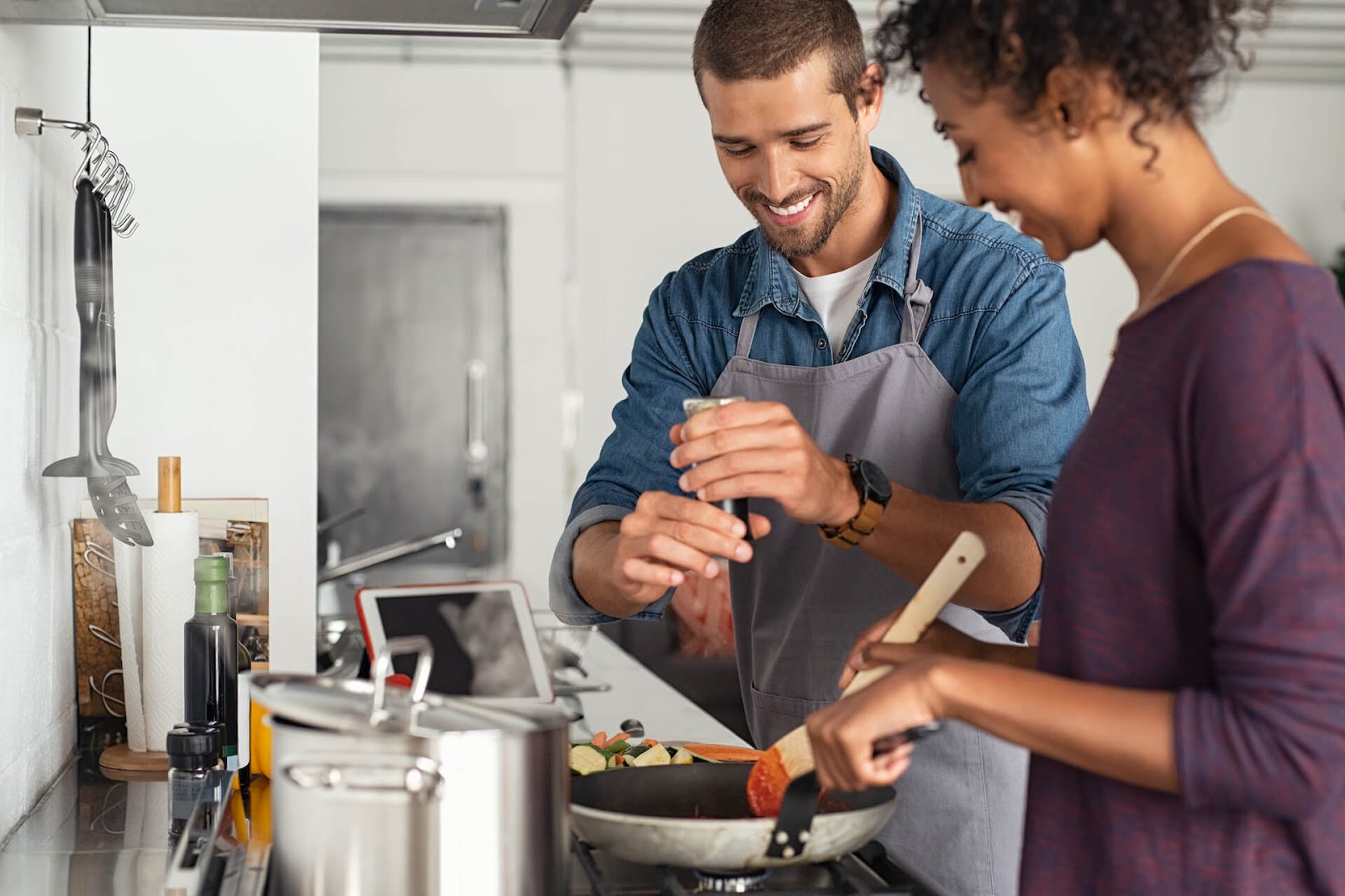 Man and woman cooking in the kitchen together