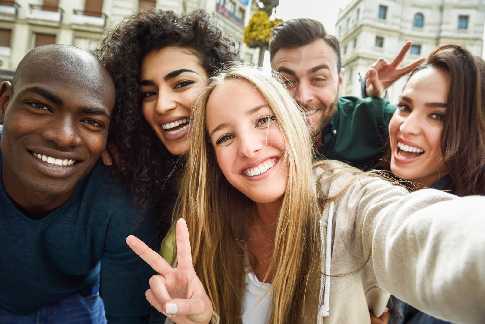 Friends taking selfie in town