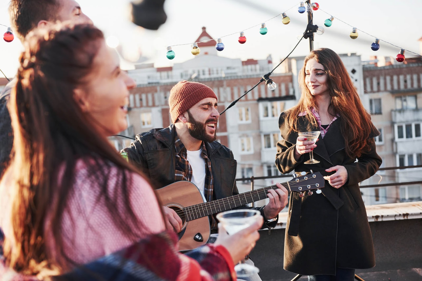 Friends playing music on a rooftop