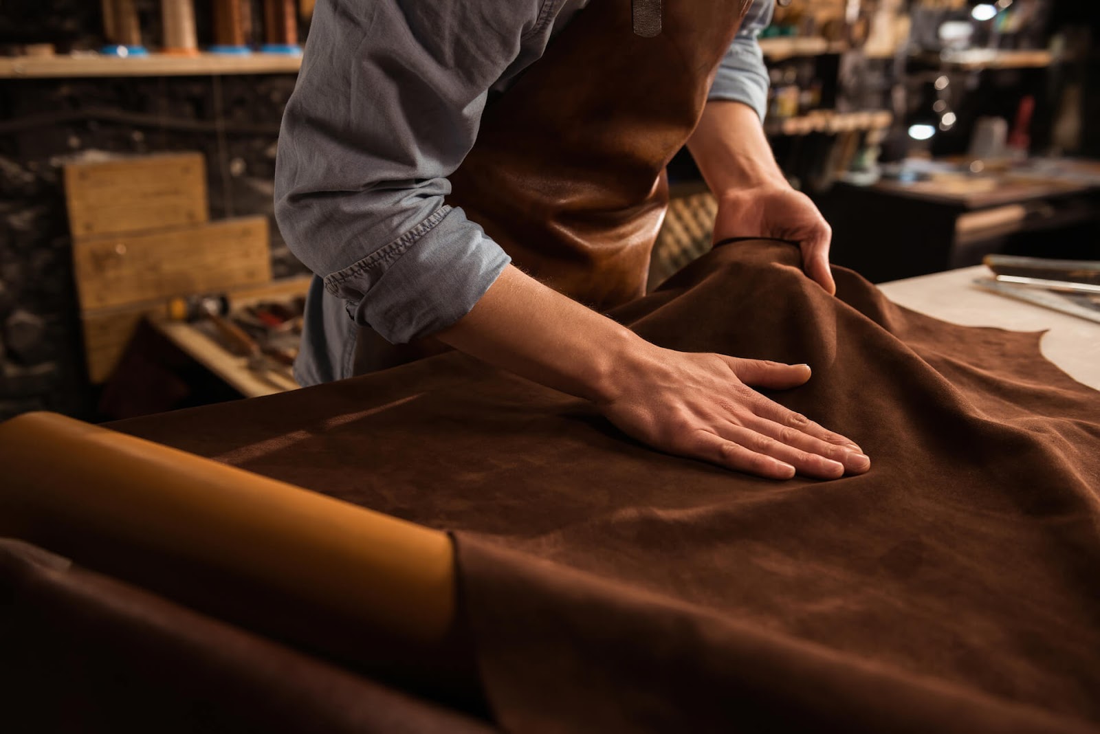 Man working with leather hides