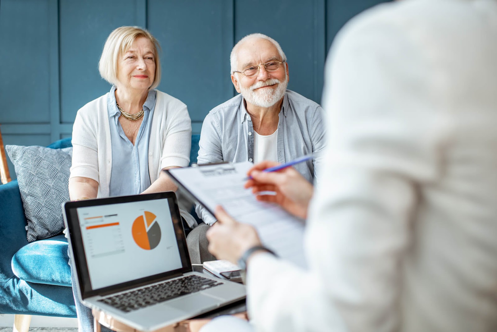 Financial advisors talking to very happy couple that just won the lottery