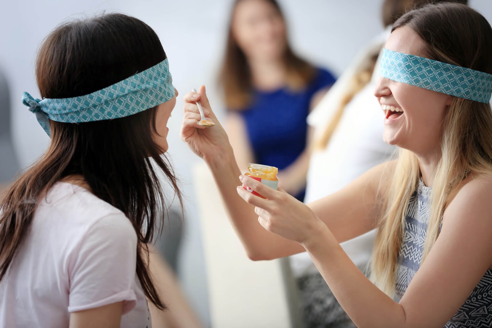 Two women playing guess that baby food
