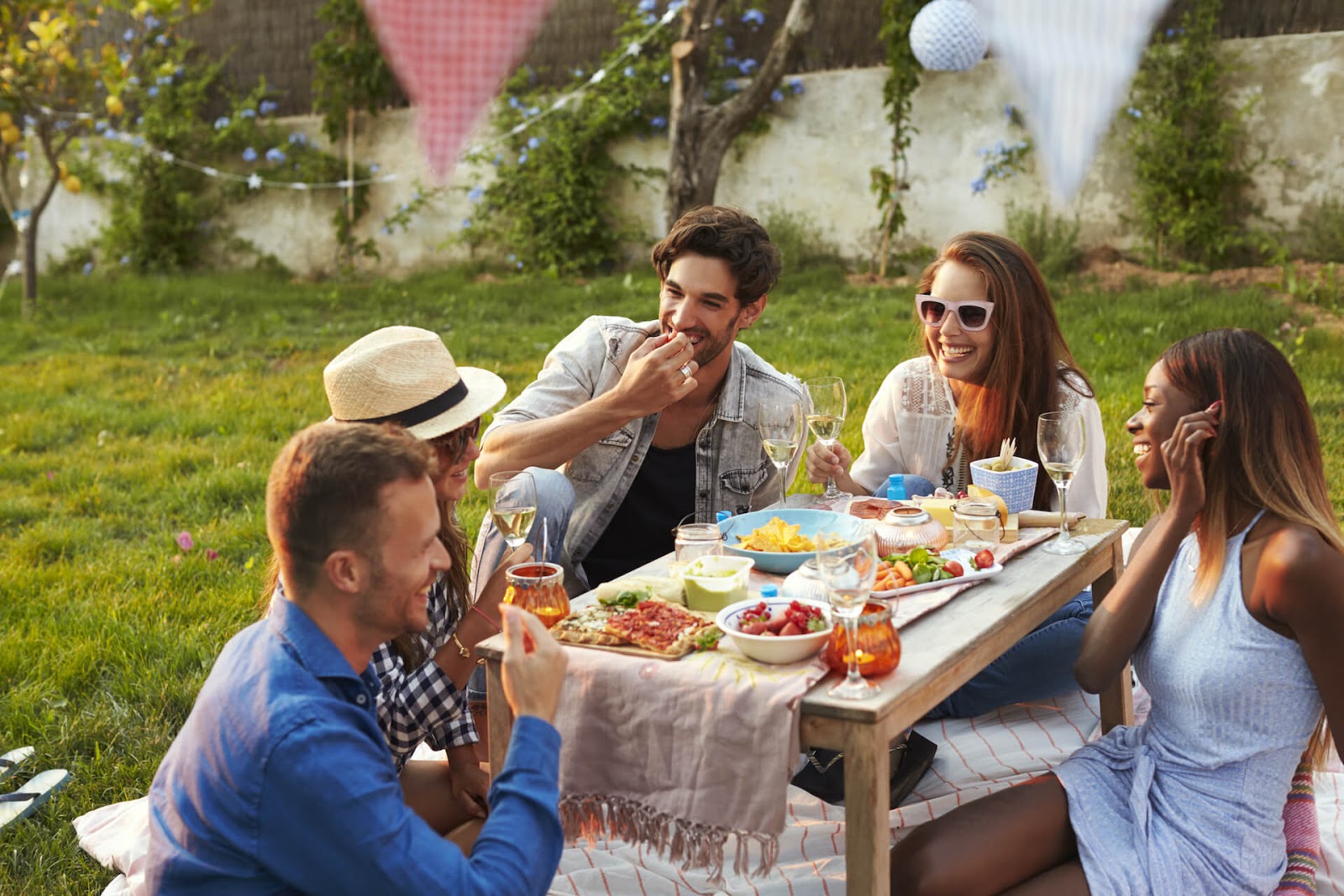 Friends outside enjoying a nice dinner outside