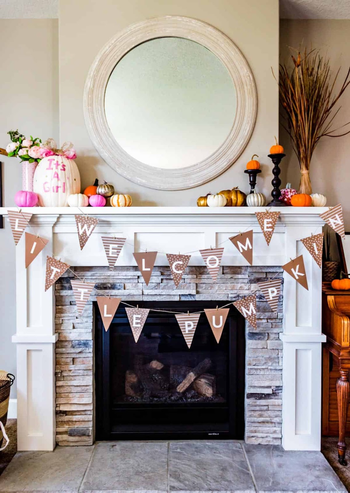 Pumpkin themed baby shower banner over the mantle