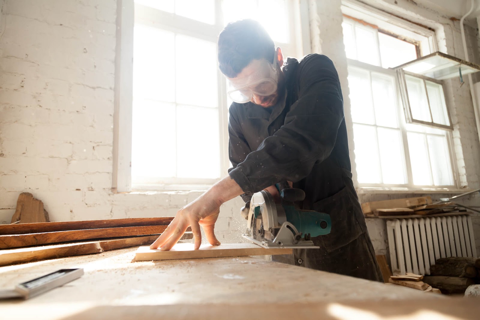 Man cutting cabinets