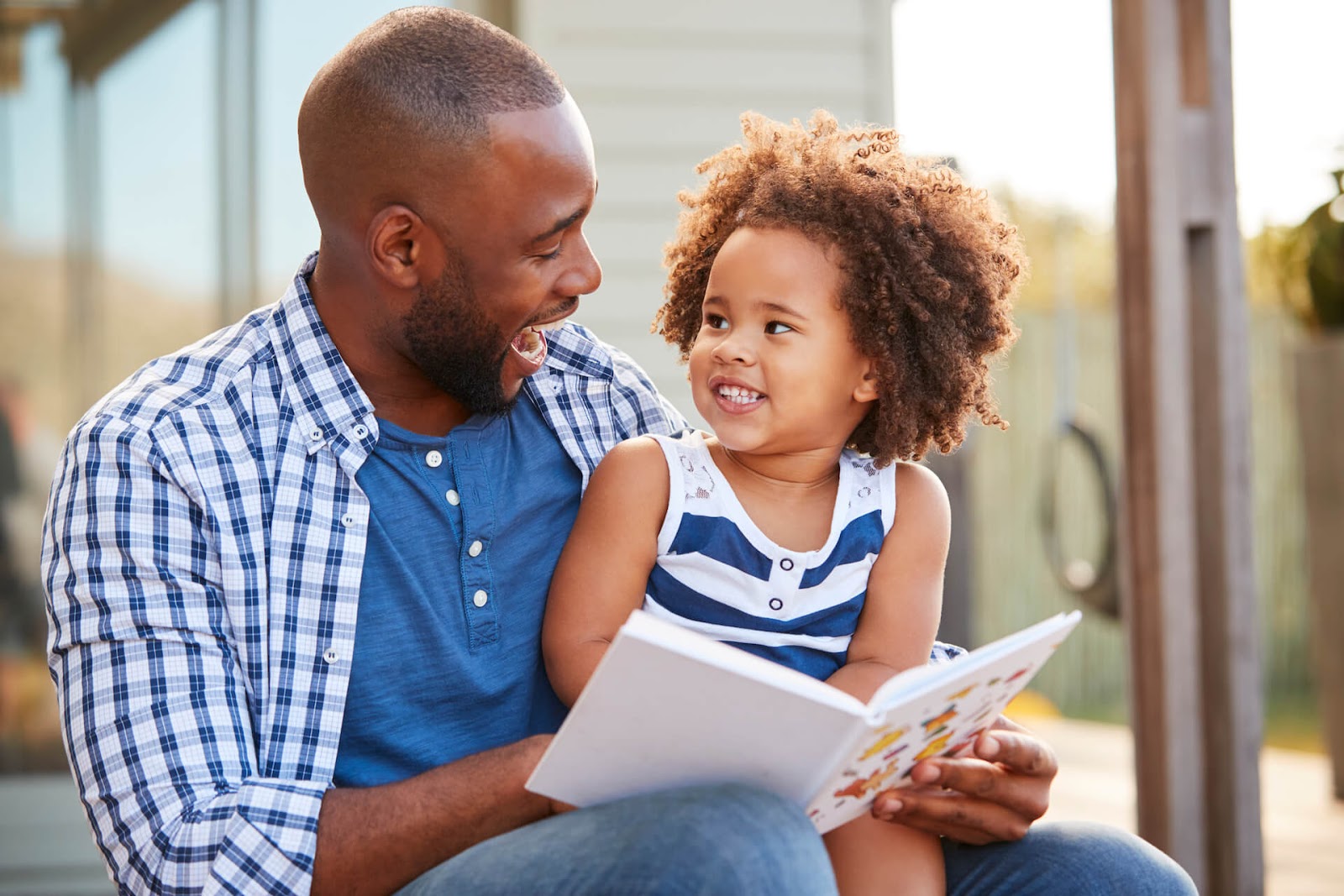 Father reading to his daughter