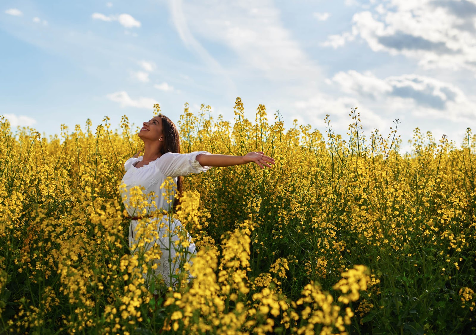 Woman smiling in field of flowers