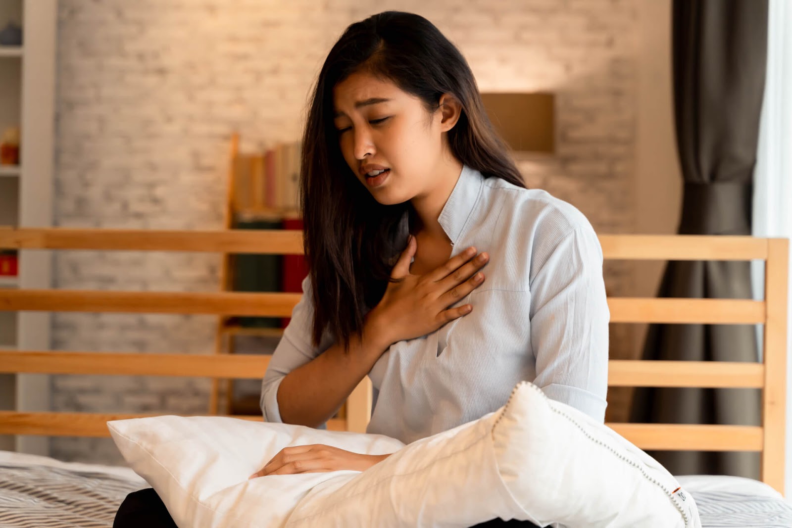 Woman holding her chest to catch her breath