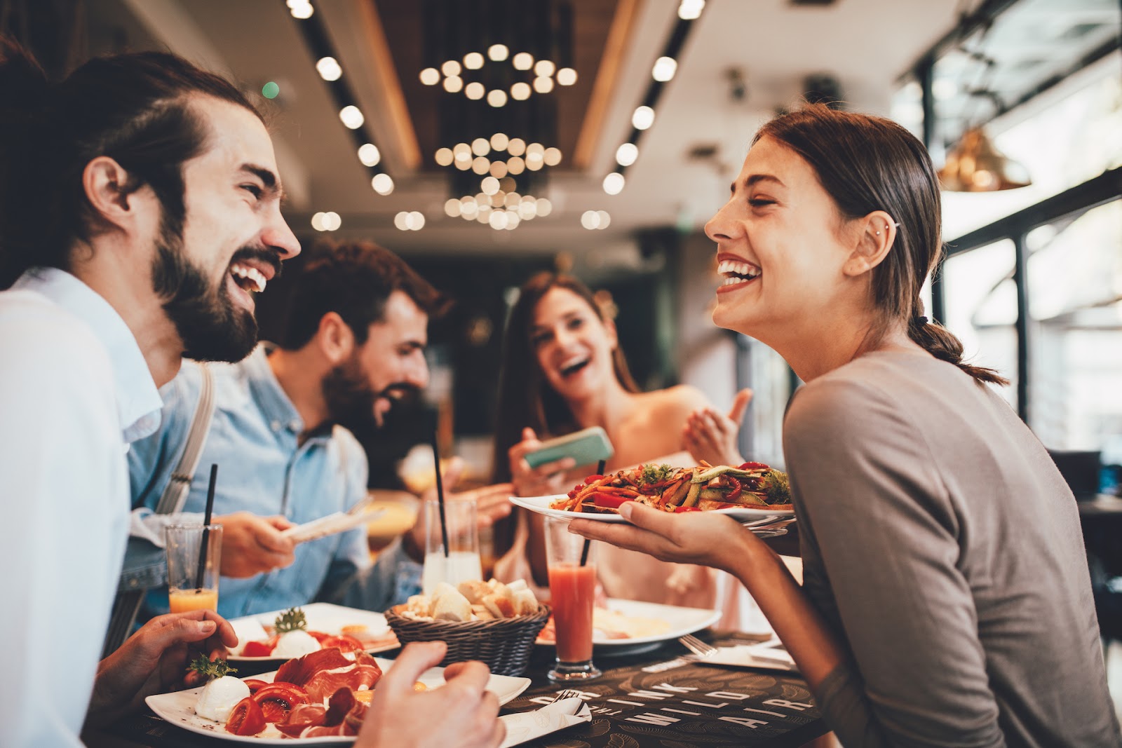 Friends out to eat, enjoying a meal together