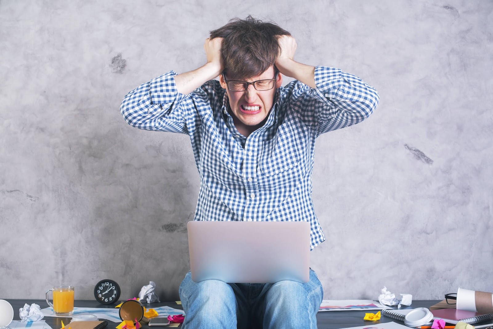 Man pulling on his hair in frustration