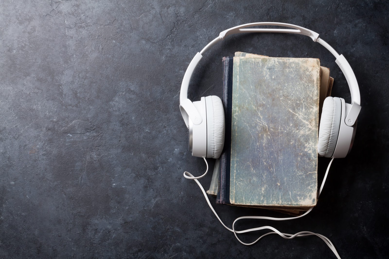 Books with some headphones over them