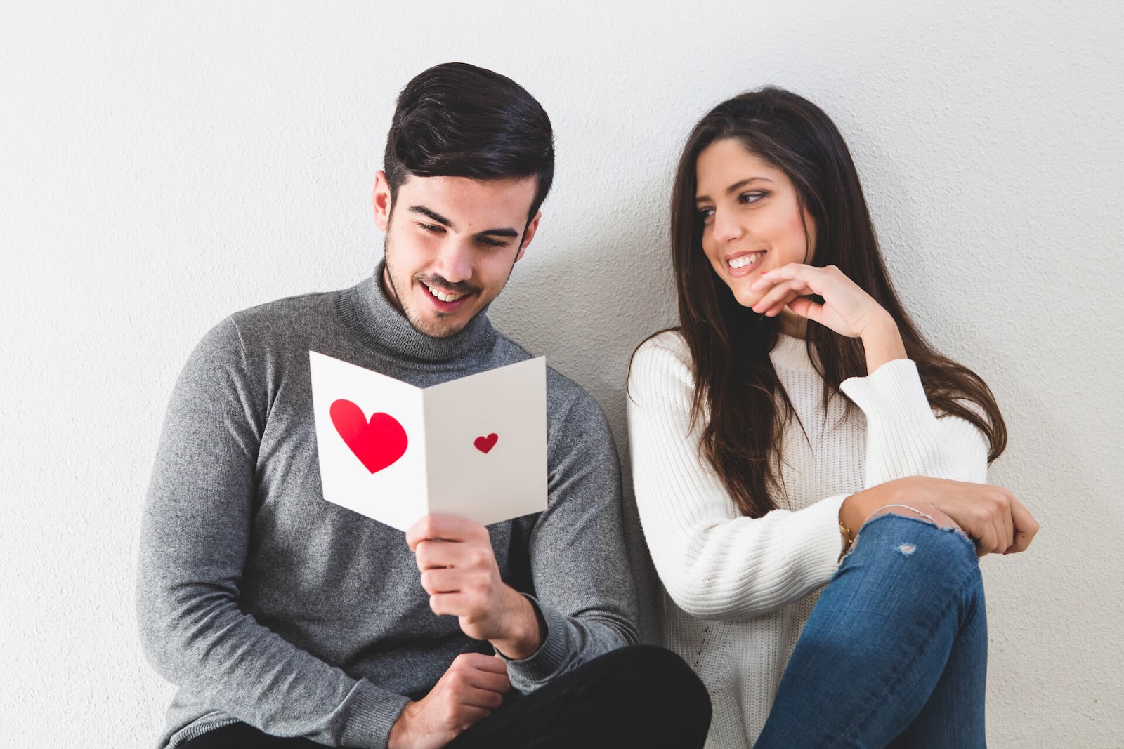Man reading a love note from a woman