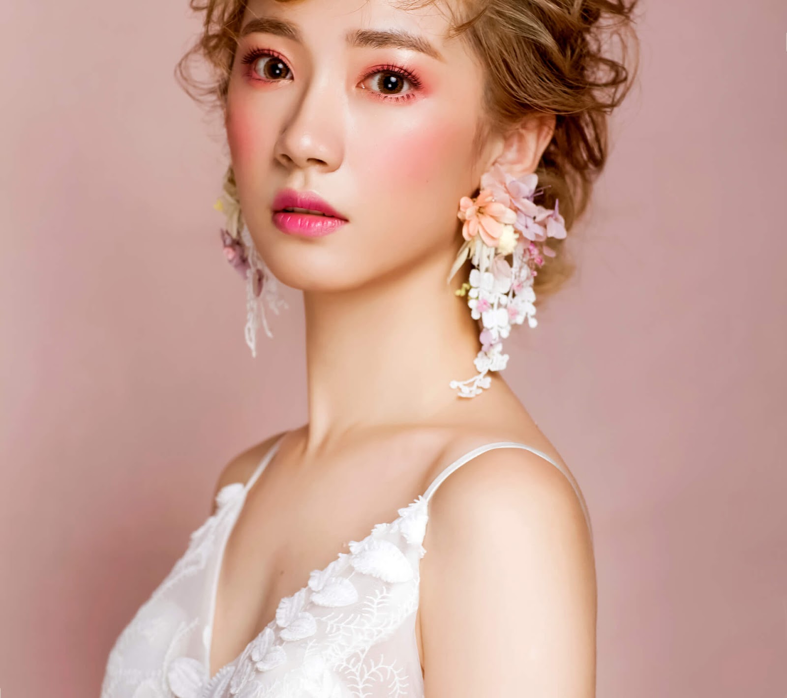 Bride in floral statement earrings