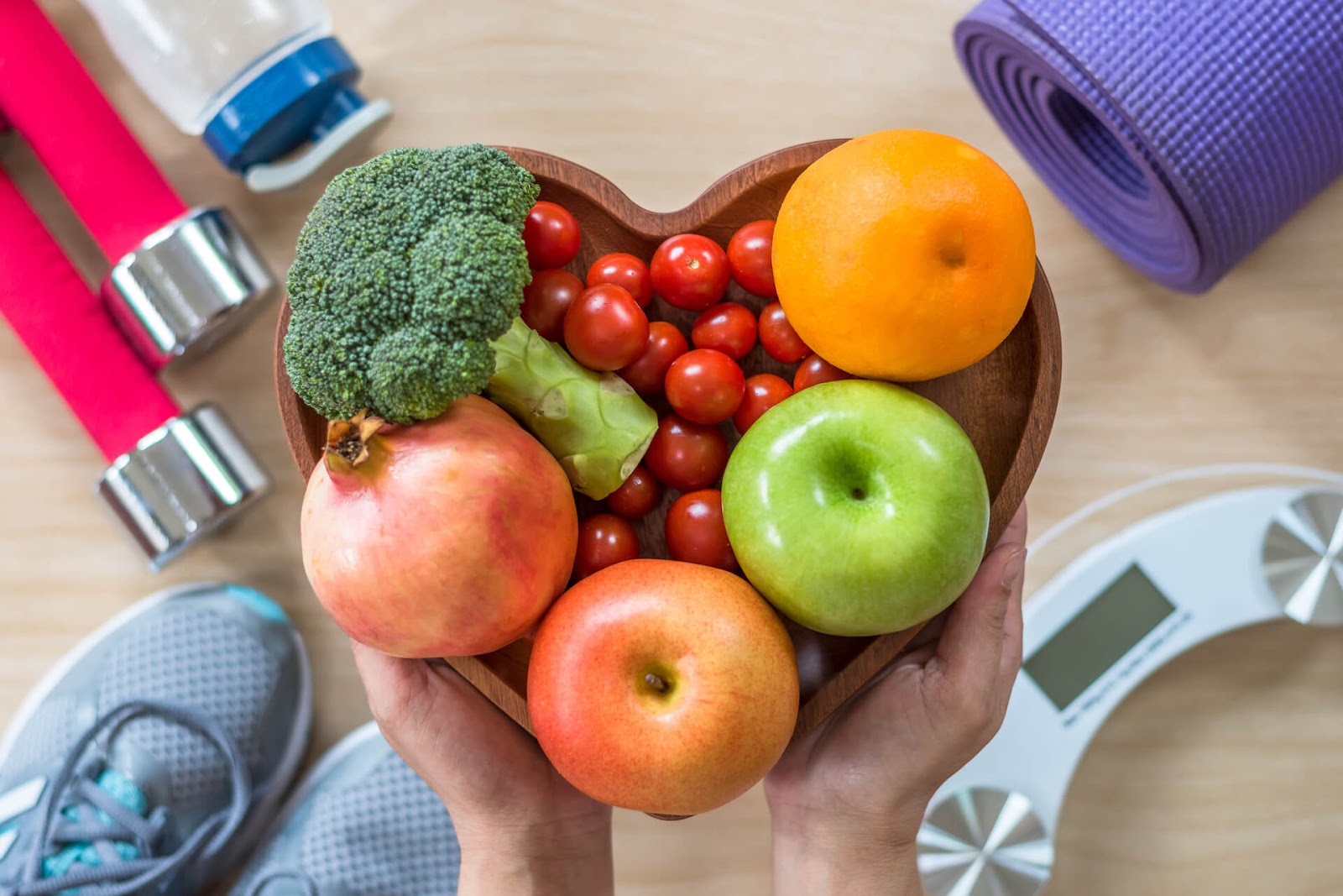 heart shaped bowl of fruits and veggies
