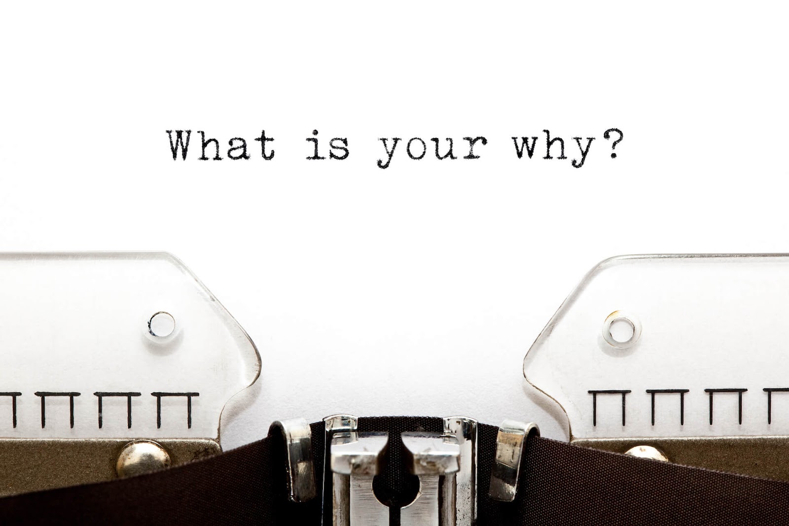 Type writer with "what is your why?" typed onto paper