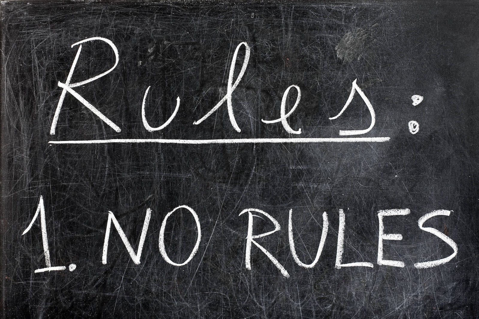 Blackboard with "Rules: 1. No Rules" written on it