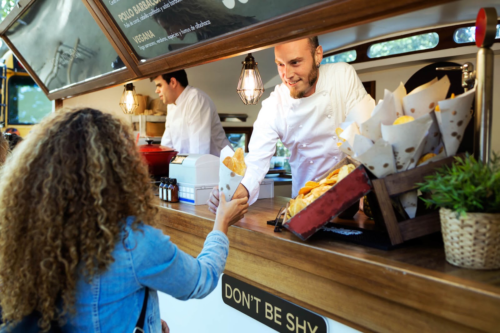 Woman getting food at a food truck