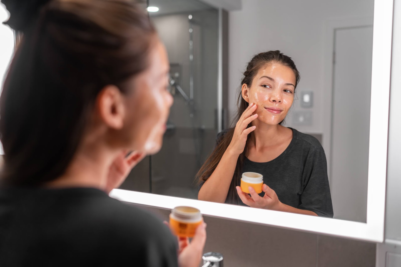 Young lady putting a face mask on